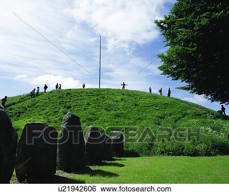 Stock Photograph - Large group of people in Jelling Mounds, Denmark. Fotosearch