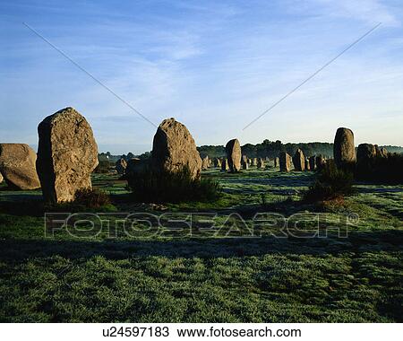 Stock Image - Large rocks in grassland, Bretagne, France. Fotosearch
