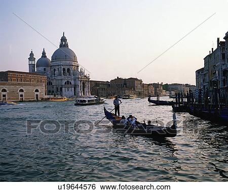 Stock Photograph - Tourists riding in gondola, Venice, Italy. Fotosearch
