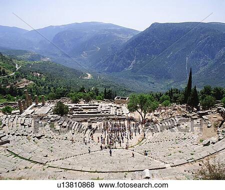 Stock Photo - Tourists visiting archaeological site in Delphi, Greece. Fotosearch