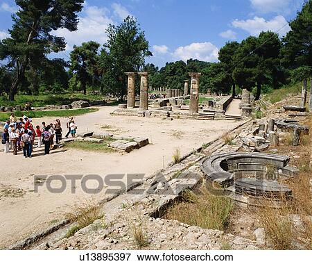 Stock Photo - Tourists visiting archaeological site in Olympia, Greece. Fotosearch