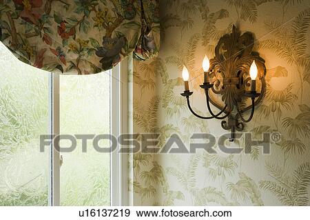 Stock Photo - Candelabra with Elcetric Candles on Wall. Fotosearch