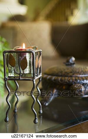 Candle and box on coffee table View Large Photo Image Picture - Candle and box on coffee table. Fotosearch