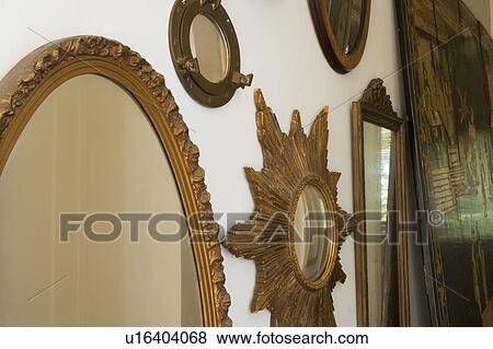 Collection of unique mirrors on wall View Large Photo Image Stock Photo - Collection of unique mirrors on wall. Fotosearch