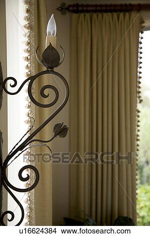 Detail of decorative wrought iron with light View Large Photo Image Picture - Detail of decorative wrought iron with light. Fotosearch