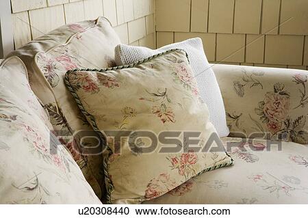 Stock Image - Detail of Floral Sofa with Pillows. Fotosearch