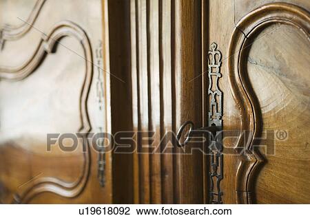 Detail of Ornate Wooden Armoire with Key View Large Photo Image Stock Image - Detail of Ornate Wooden Armoire with Key. Fotosearch