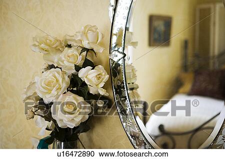 Detail of white roses next to antique vanity mirror View Large Photo Image Stock Image - Detail of white roses next to antique vanity mirror. Fotosearch