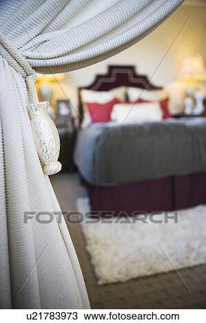 Drapery pulled back to view of bedroom View Large Photo Image Stock Image - Drapery pulled back to view of bedroom. Fotosearch