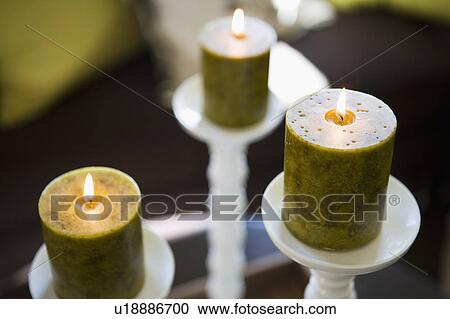 Stock Image - Green Candles with Flame. Fotosearch