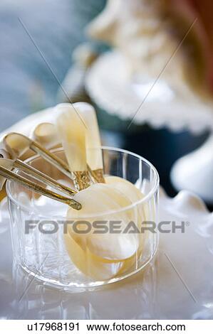Stock Image - Ivory Spoons in Glass Dish. Fotosearch