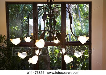 Stock Image - Metal Chandelier with Many Lamps. Fotosearch