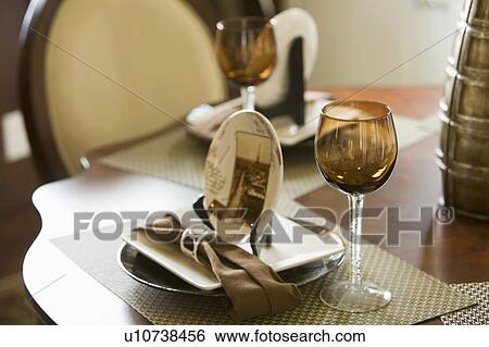 Stock Photograph - Place setting with brown wine glass. Fotosearch
