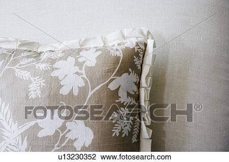 Tan flowered pillow on sofa View Large Photo Image Stock Image - Tan flowered pillow on sofa. Fotosearch