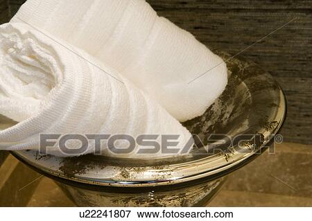 Stock Photo - Towel display in gold bowl. Fotosearch