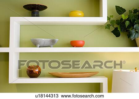 Stock Image - Contemporary Display Shelf with Collorful Pottery. Fotosearch