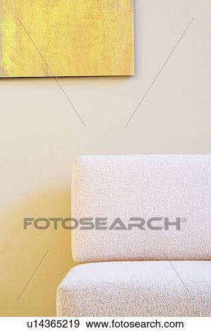 Stock Photo - Detail of White Chair under Painting. Fotosearch