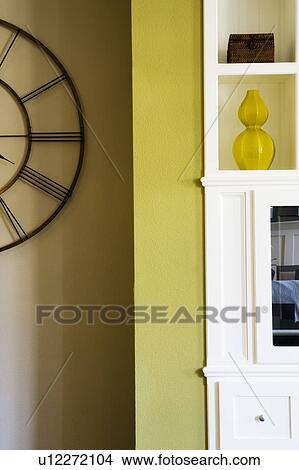 Picture - Edge of Green Wall and White Built In Entertainment Center. Fotosearch