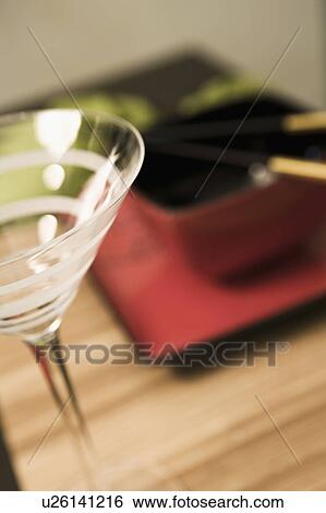 Stock Photograph - Empty martini glass and contemporary place setting. Fotosearch