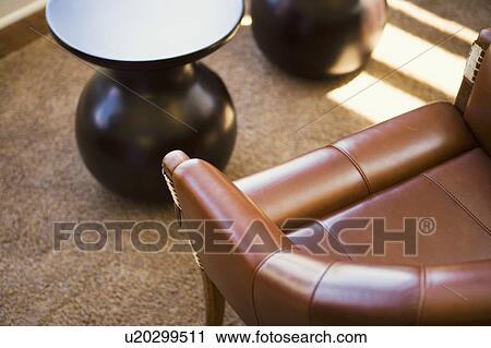 Tan leather armchair and table View Large Photo Image Stock Image - Tan leather armchair and table. Fotosearch