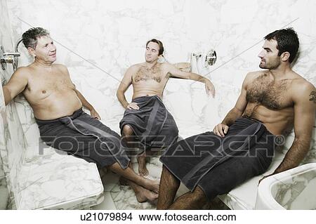 Two mid adult men and a senior man sitting in the bathroom and talking to each other View Large Photo Image Picture - Two mid adult men and a senior man sitting in the bathroom and talking to each other. Fotosearch