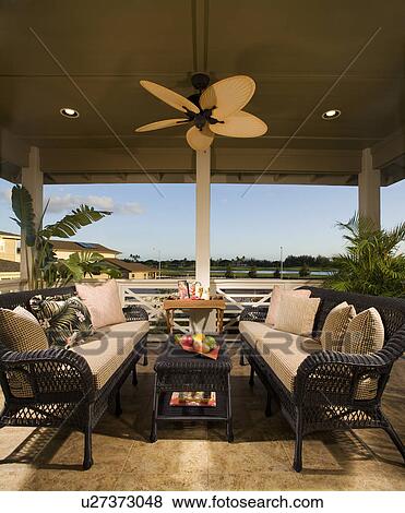 Covered Patio with Sofas and Ceiling Fan View Large Photo Image Stock Photo - Covered Patio with Sofas and Ceiling Fan. Fotosearch