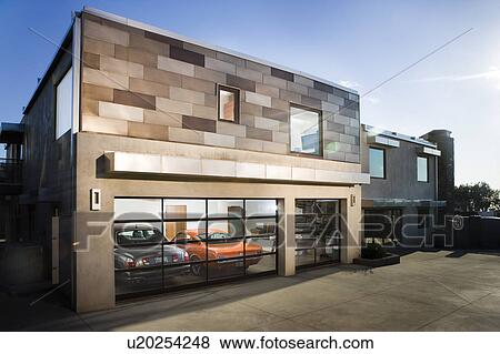 Stock Photo - Exterior of modern home garage and cars. Fotosearch
