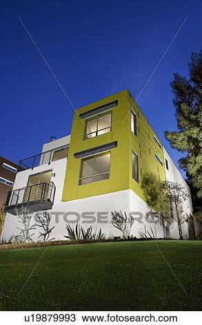 Front exterior of modern condominium at dusk View Large Photo Image Stock Image - Front exterior of modern condominium at dusk. Fotosearch