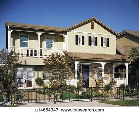 Stock Photo - Front exterior of traditional American house. Fotosearch