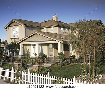 Stock Image - Front Exterior of Traditional Home. Fotosearch