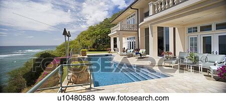 Large Swimming Pool and Deck in Coastal Mansion View Large Photo Image Stock Image - Large Swimming Pool and Deck in Coastal Mansion. Fotosearch