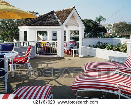 Stock Image - Rooftop patio with gazebo. Fotosearch
