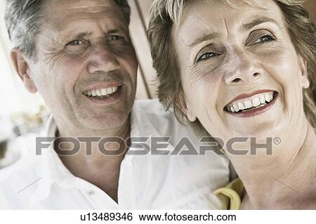 Close-up of a mature woman with a senior man smiling View Large Photo Image Stock Photograph - Close-up of a mature woman with a senior man smiling. Fotosearch