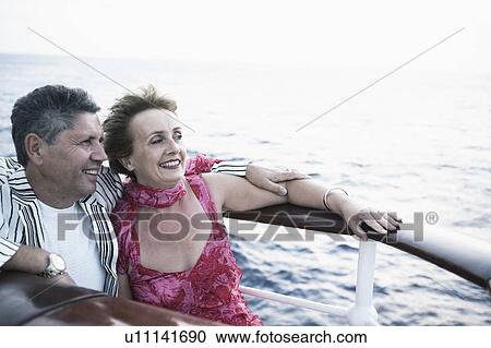 Mature woman and a senior man smiling in a ship View Large Photo Image Stock Image - Mature woman and a senior man smiling in a ship. Fotosearch