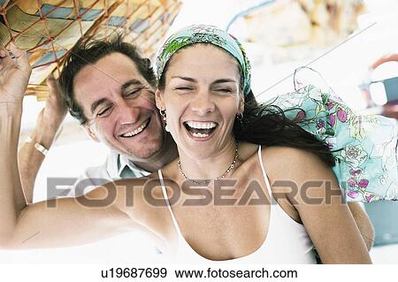 Mid adult couple smiling View Large Photo Image Stock Photo - Mid adult couple smiling. Fotosearch