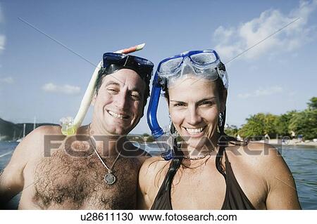 Portrait of a mid adult couple smiling View Large Photo Image Stock Image - Portrait of a mid adult couple smiling. Fotosearch