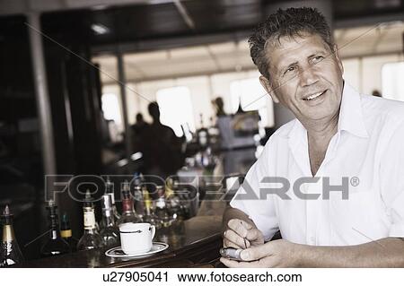Close-up of a senior man using a mobile phone View Large Photo Image Stock Image - Close-up of a senior man using a mobile phone. Fotosearch