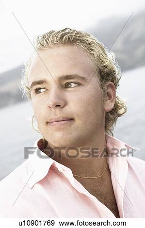 Close-up of a young man View Large Photo Image Stock Photo - Close-up of a young man. Fotosearch