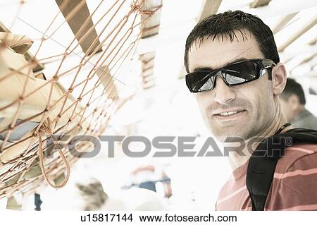 Picture - Mid adult man smiling. Fotosearch