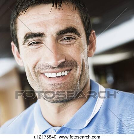 Stock Image - Portrait of a mid adult man smiling. Fotosearch