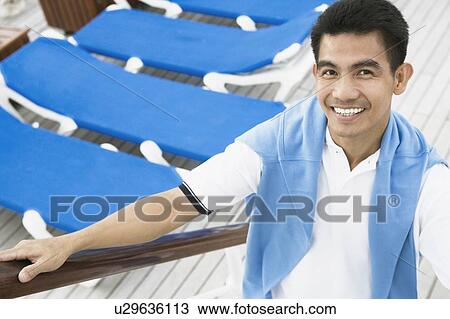 Portrait of a young man smiling View Large Photo Image Stock Image - Portrait of a young man smiling. Fotosearch