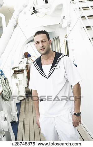 Portrait of a young man standing on the deck of a cruise ship View Large Photo Image Stock Photography - Portrait of a young man standing on the deck of a cruise ship. Fotosearch