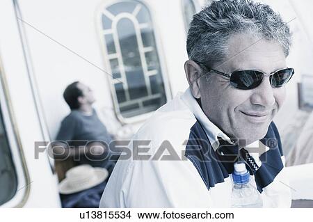 Side profile of a senior man smiling View Large Photo Image Picture - Side profile of a senior man smiling. Fotosearch