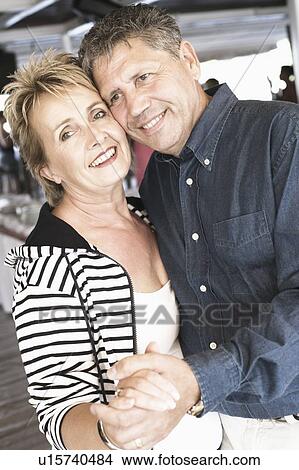 Side profile of a mature woman dancing with a senior woman in a nightclub and smiling View Large Photo Image Picture - Side profile of a mature woman dancing with a senior woman in a nightclub and smiling. Fotosearch