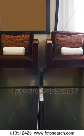 Detail of two arm chairs with coffee table View Large Photo Image Stock Photography - Detail of two arm chairs with coffee table. Fotosearch
