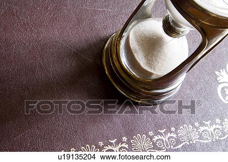 Picture - Old Fashioned Brass Hourglass. Fotosearch