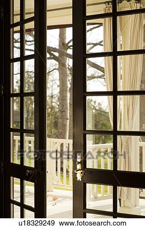 Stock Photo - Open French Doors to Outside. Fotosearch