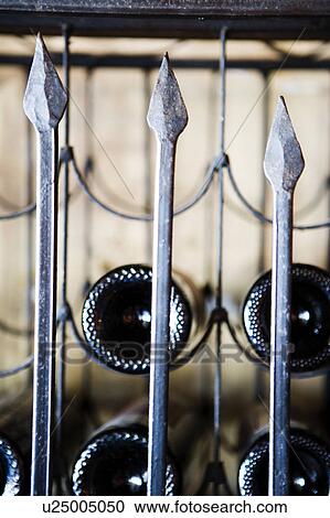Wrought Iron Wine Rack and Bottles. View Large Photo Image Stock Image - Wrought Iron Wine Rack and Bottles.. Fotosearch