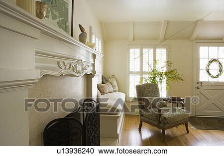 Fireplace and armchair in living room View Large Photo Image Stock Image - Fireplace and armchair in living room. Fotosearch