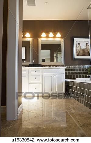 Stock Image - Large Brown Master Bathroom. Fotosearch